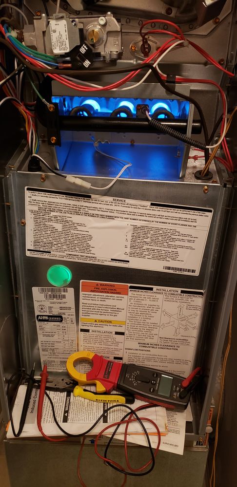 Gas furnace undergoing a professional heating tune-up