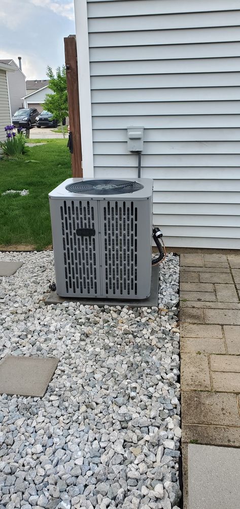 Customer photo of an outdoor air conditioning condenser beside a Noblesville home